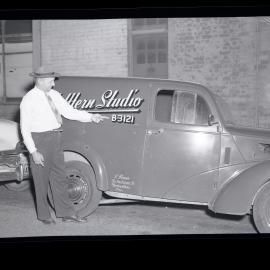 Gentleman in hat and company vehicle, S Power