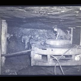 Men underground with machinery
