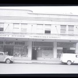 Street view of city building with shops