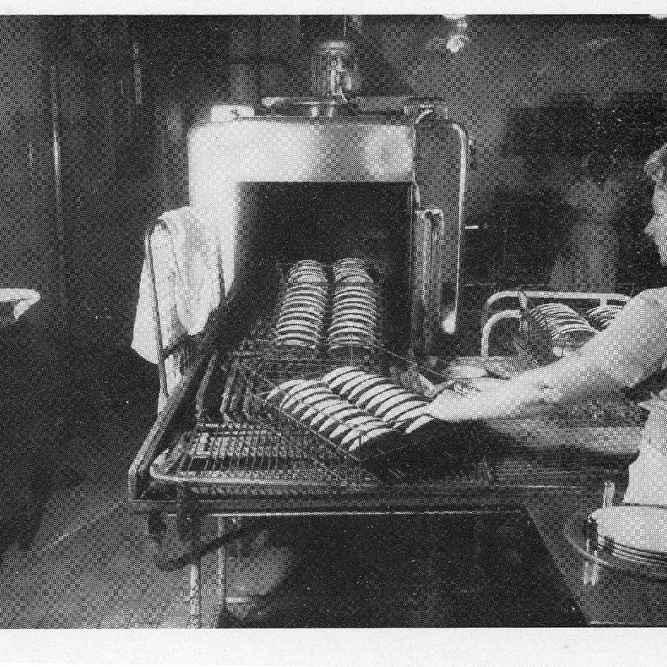 Female staff loading dishes in dishwasher, Royal Newcastle Hospital, Dietary Department, 1960s