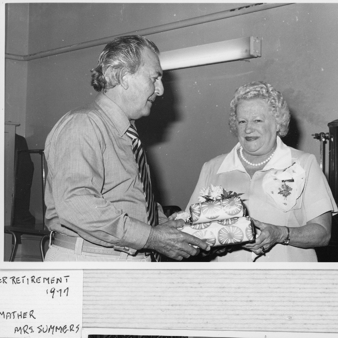 Mrs. Summers, right and Mr. Mather, left at Mrs. Summers retirement event, Royal Newcastle Hospital, Dietary Department, 1977