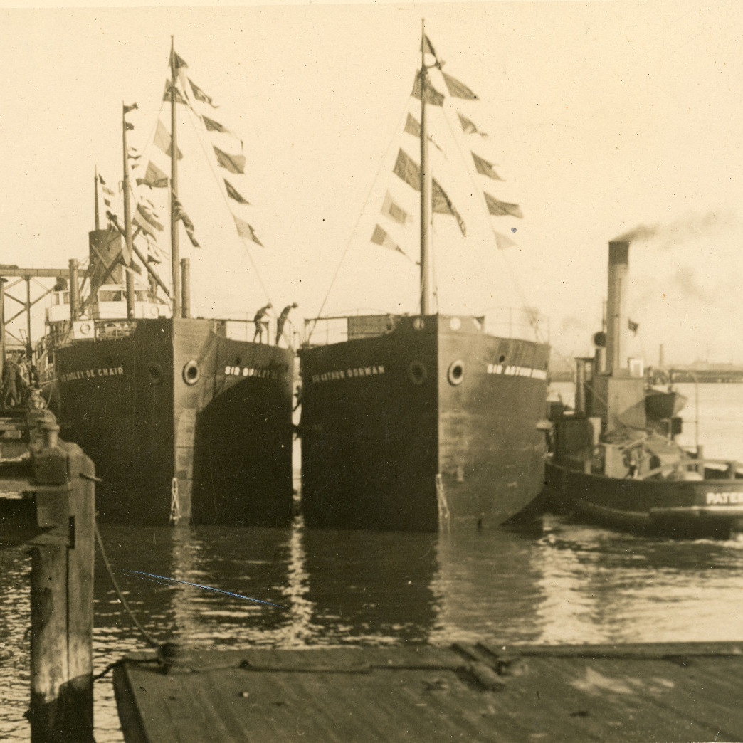 'Sir Arthur Dorman' being fitted out next to 'Sir Dudley De Chair' (Left) and Tug 'Paterson' (Right)
