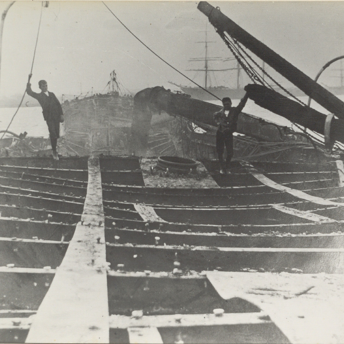 Two Boys standing on Burnt-Out Shipwreck 'Itata', 1906