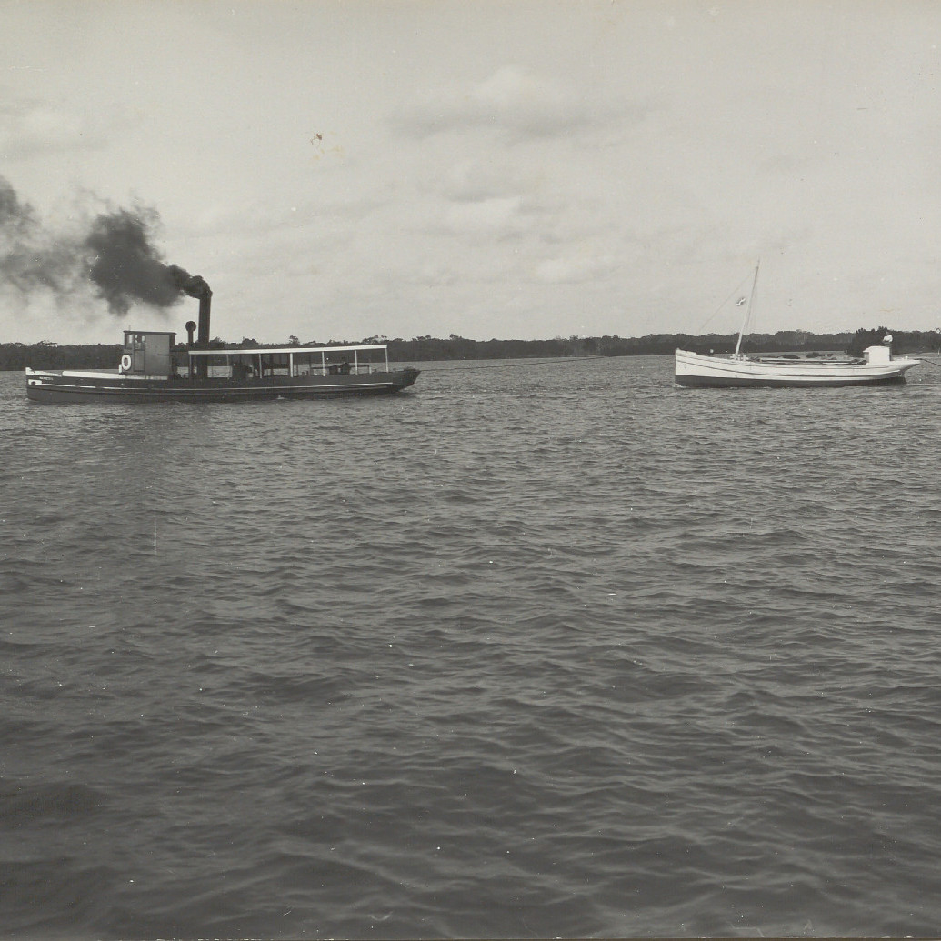 Tugboat pulling smaller ship in Newcastle Waterways, 1912
