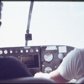 Unknown people at control panel, unknown location [1960s]