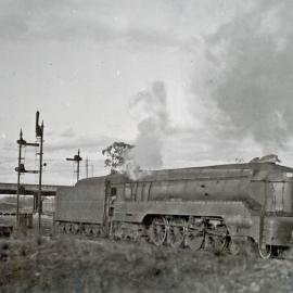SAR Class 520, No. 521, 4-8-4 Type shark-nosed express, passenger locomotive running light-engine near Mile End, Adelaide, [1940s]