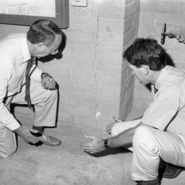 Professor Adrian Page with Professor Rob Melchers inspecting earthquake damage, the University of Newcastle, Australia, 1992