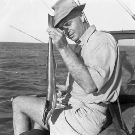 Bob Newbiggen with a large remora caught on a handline at Stockton Bight from Dr Watkins' Boat