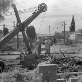 Maitland Flood, 1955 - Cleaning up - St. Mary’s Anglican Church in the background