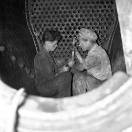 South Maitland Railways, men working on the boilers of engines, 1961