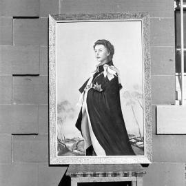 Painting of H.M. the Queen by one of the Maitland gaol prisoners - copies from a painting by Annigoni - painting held by the Governor of the gaol, Mr. Dwyer, photograph 1961