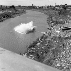 Pylon falling into river during demolition of old Belmore Bridge, Maitland, NSW, 1965