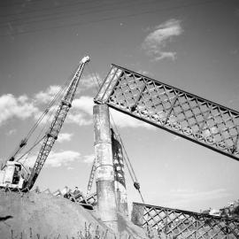Crane lifting part of old Belmore Bridge, Maitland, NSW, 1965