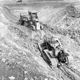 Tractor loading truck, construction of Balickera Canal, NSW, 1963