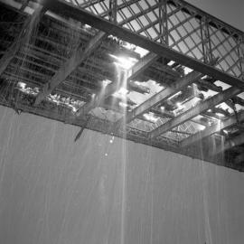 Debris and flames, decking of old Belmore Bridge being burnt during demolition, Maitland, NSW, June 12 1965