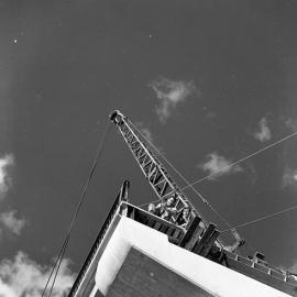 Two construction workers looking down from pier of new Belmore Bridge, Maitland, NSW, June 1963