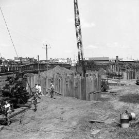 Workers in front of timber construction, new Belmore Bridge, Maitland, NSW, 1961
