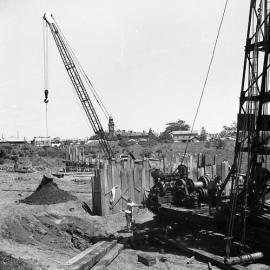 Machinery at construction site for new Belmore Bridge, Maitland, NSW, 1961