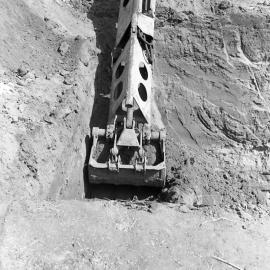 Excavator in action, construction of new Belmore Bridge, Maitland, NSW, 1961