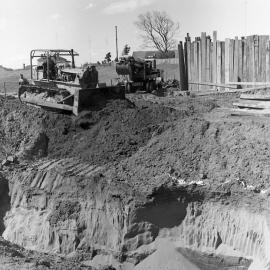 Tractor clearing ground for new Belmore Bridge, Maitland, NSW, 1961