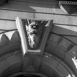 Gargoyle on David Cohen and Company building at the time of the fire, High Street, Maitland, NSW, June 1970