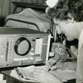 A nurse checks the condition of a patient in the coronary care section of the intensive care ward, Royal Newcastle Hospital, 15 July 1969