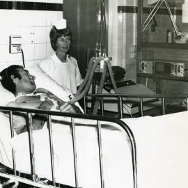 A nurse tends to a patient in the intensive care ward, Royal Newcastle Hospital, Newcastle, NSW, [late 1960s]
