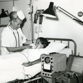 A nurse tends to a patient in the intensive care ward, Royal Newcastle Hospital, Newcastle, NSW, [late 1960s]