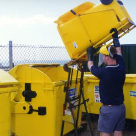 Emptying a bin for the Royal Newcastle Hospital's recycling initiative, Newcastle, NSW, 1997