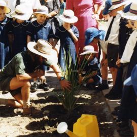 School children involved in planting a new garden outside the Nickson Wing, Royal Newcastle Hospital, Newcastle, NSW, 1996