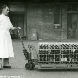 Moving crates of ether sulphate, Royal Newcastle Hospital's Pharmacy, Newcastle, NSW