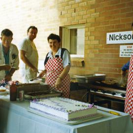 Cooking sausages at the Royal Newcastle Hospital's Appreciation BBQ, held outside the entrance to the Nickson wing, 4 June 1998