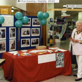 A "Pink lady" volunteer at the occupational therapy display during Health Week, Royal Newcastle Hospital, 1994