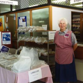 A "Pink lady" volunteer at a Lamington drive during Health Week, Royal Newcastle Hospital, Newcastle, NSW, 1994