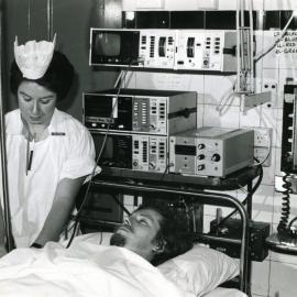 Patient and nurse in the intensive care unit, Royal Newcastle Hospital, Newcastle, NSW