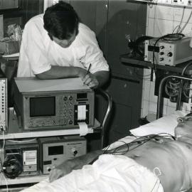 Patient with a cardiac impedance monitor in the intensive care ward, Royal Newcastle Hospital, Newcastle, NSW