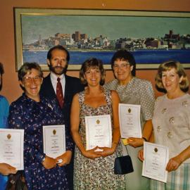 Unidentified hospital staff holding certificates, Royal Newcastle Hospital, Newcastle, NSW