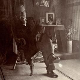 Portrait of man (Samuel Thomas Knaggs also known as Maiben Brook) seated in cane chair, NSW, Australia, 1904.