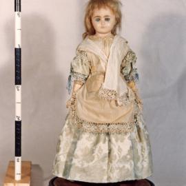 Wax doll on display stand [n.d.]