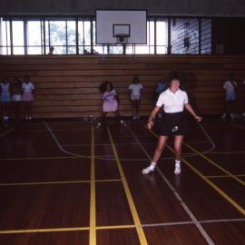 Ladies playing basketball