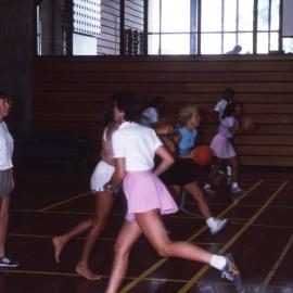 Ladies playing basketball