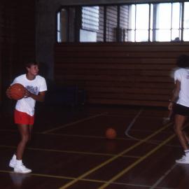 Ladies playing basketball