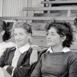 Four unidentified students at an Athletics Carnival. A photograph from the Newcastle Teachers' College, NSW, Australia 1957 Album
