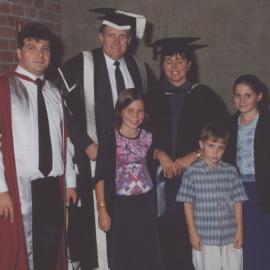 Vice-Chancellor, Professor Roger Holmes with Professor Scott Holmes (far right) and his children who attended Mrs Holmes' graduation at the graduation ceremony, the University of Newcastle, Australia - May, 2000