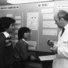 Professor Barry Boettcher in front of the Chamberlain court case display, the University of Newcastle, Australia - c.1980s
