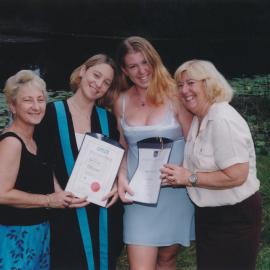 Nicole Williams and Megan Smith holding their graduation certificates