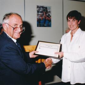 [Unknown Person presenting an award to a student n.d.]