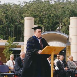 Professor Les Eastcott speaking at the Central Coast Campus Commencement Ceremony, 1997.