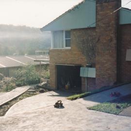 Unidentified person [builder] at Central Coast Campus [1993].