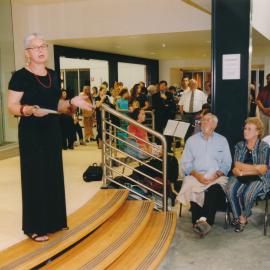 Unidentified person speaking at a Central Coast Campus art exhibition [n.d.].